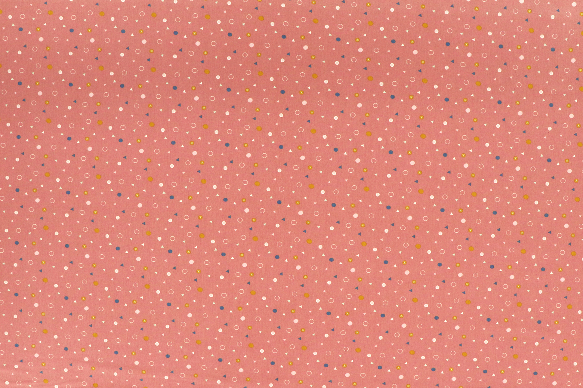 Jersey di cotone, cerchi e triangoli colorati su rosa antico