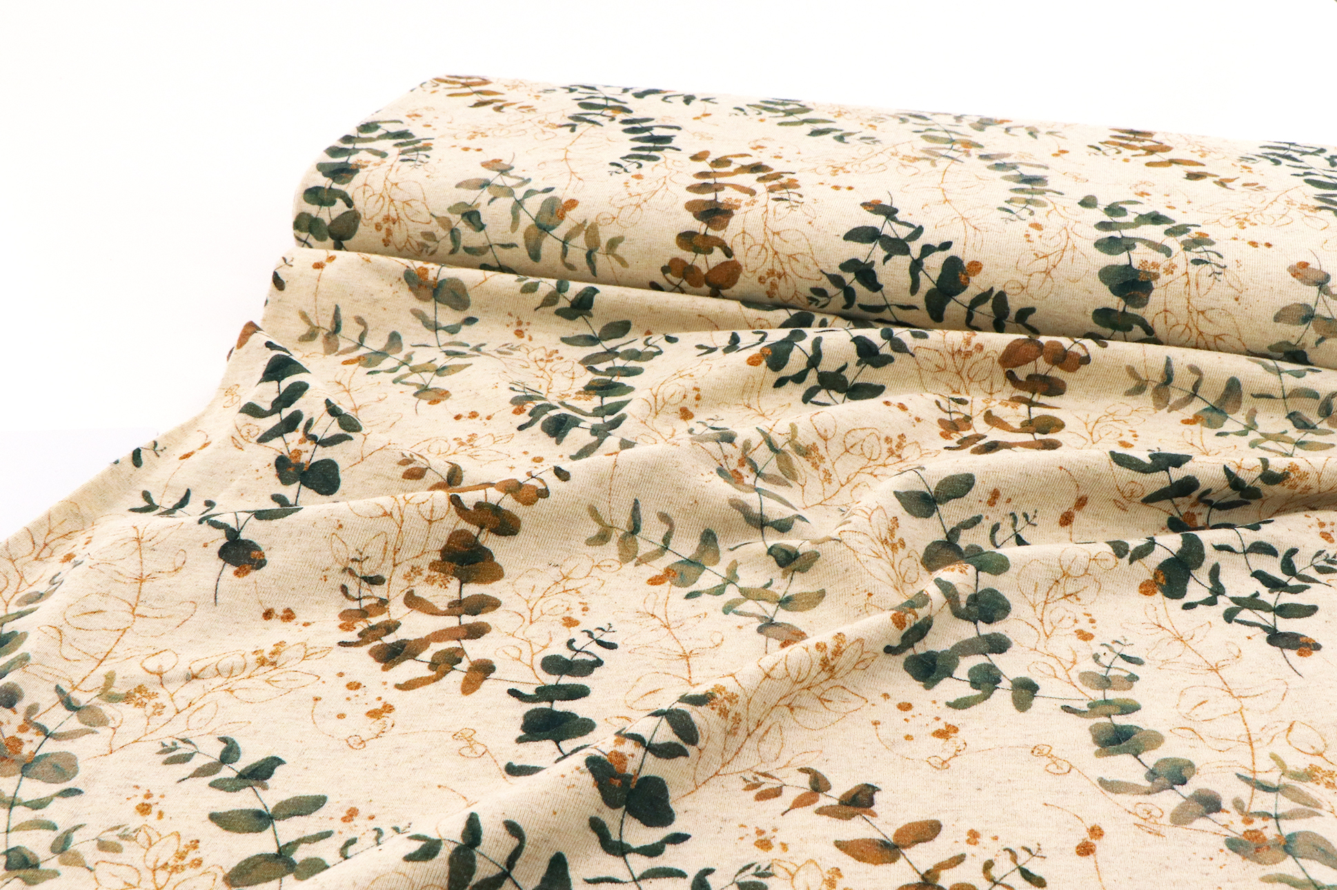Jersey di cotone, motivo a foglia su fondo beige