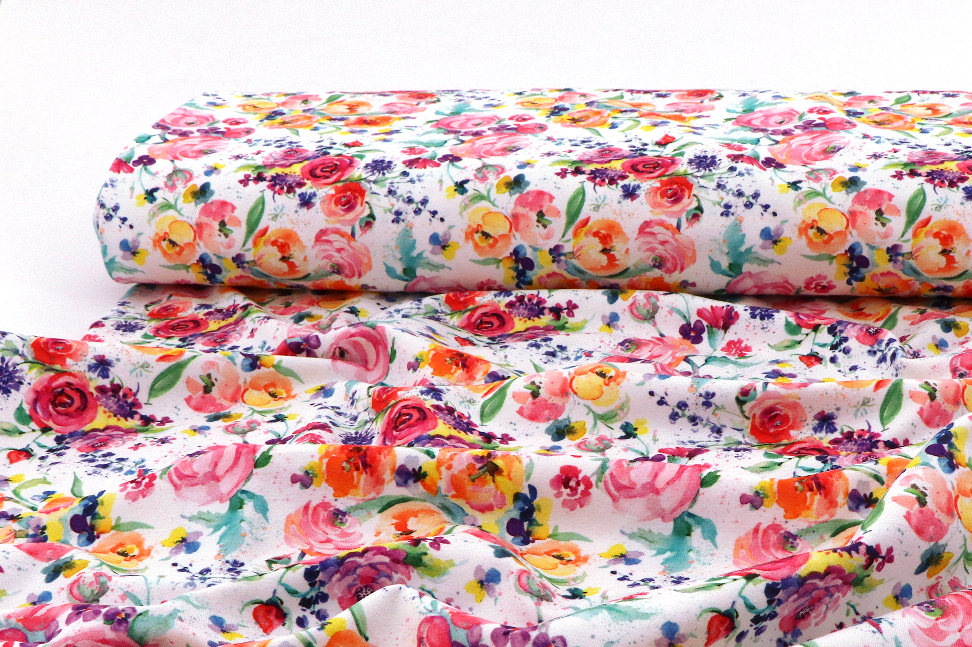 Jersey di cotone, fiori colorati su bianco